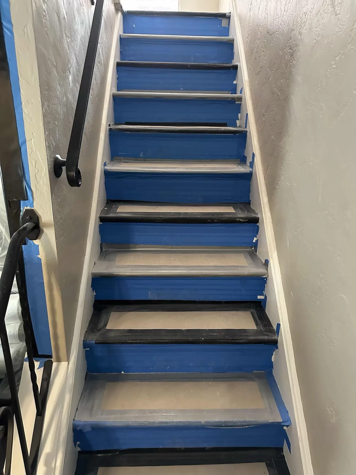 Stair treads and risers taped and papered before demolition
